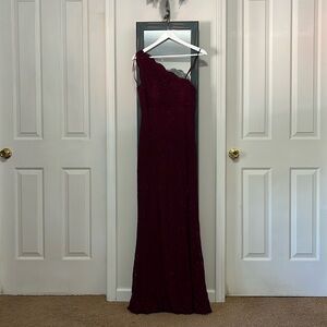 Floor-length dress purchased at Dillards. Color Burgundy. Size 8/10.